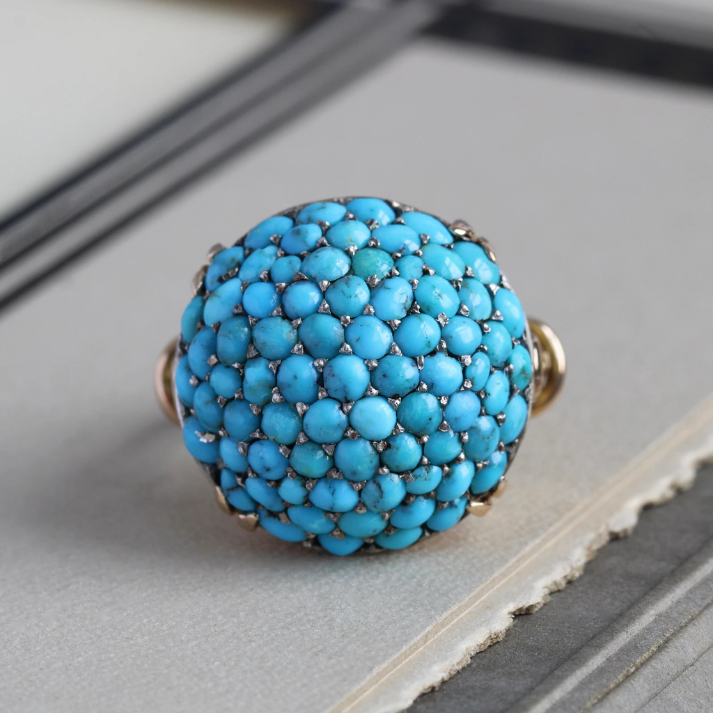 Antique yellow gold dome ring pave set with little baby blue turquoise cabochons.