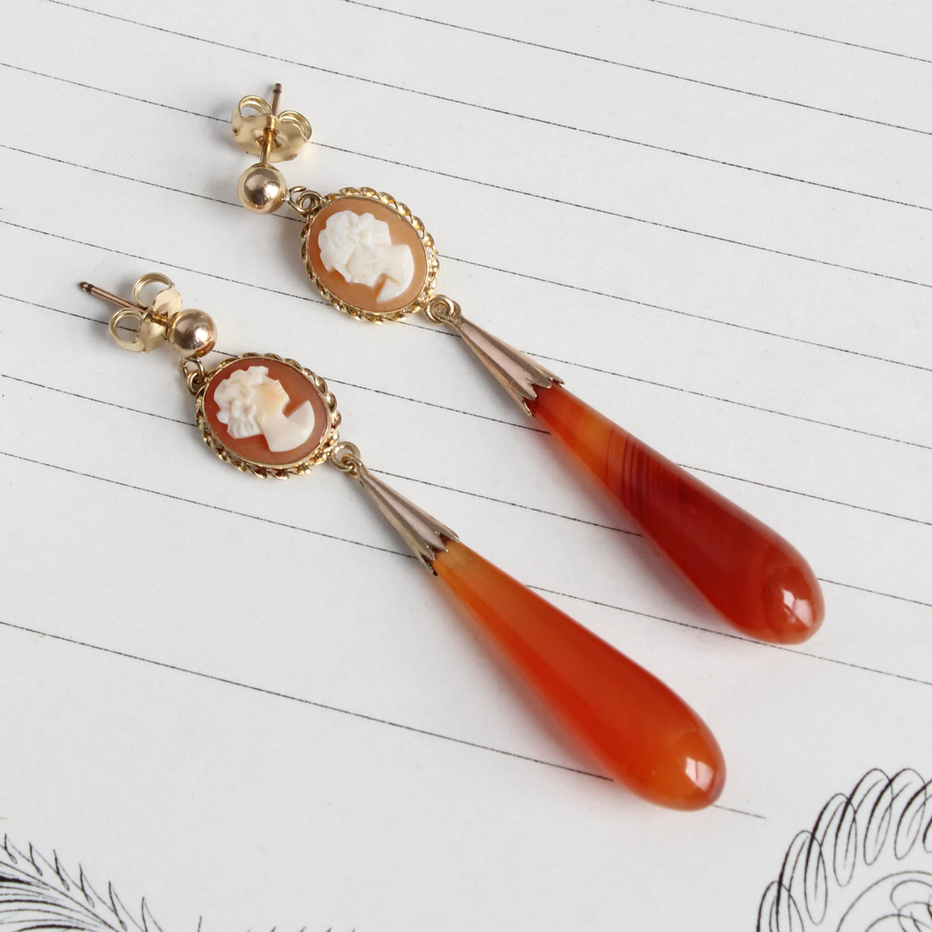 Vintage orange cameo earrings with long teardrop carnelian beads.