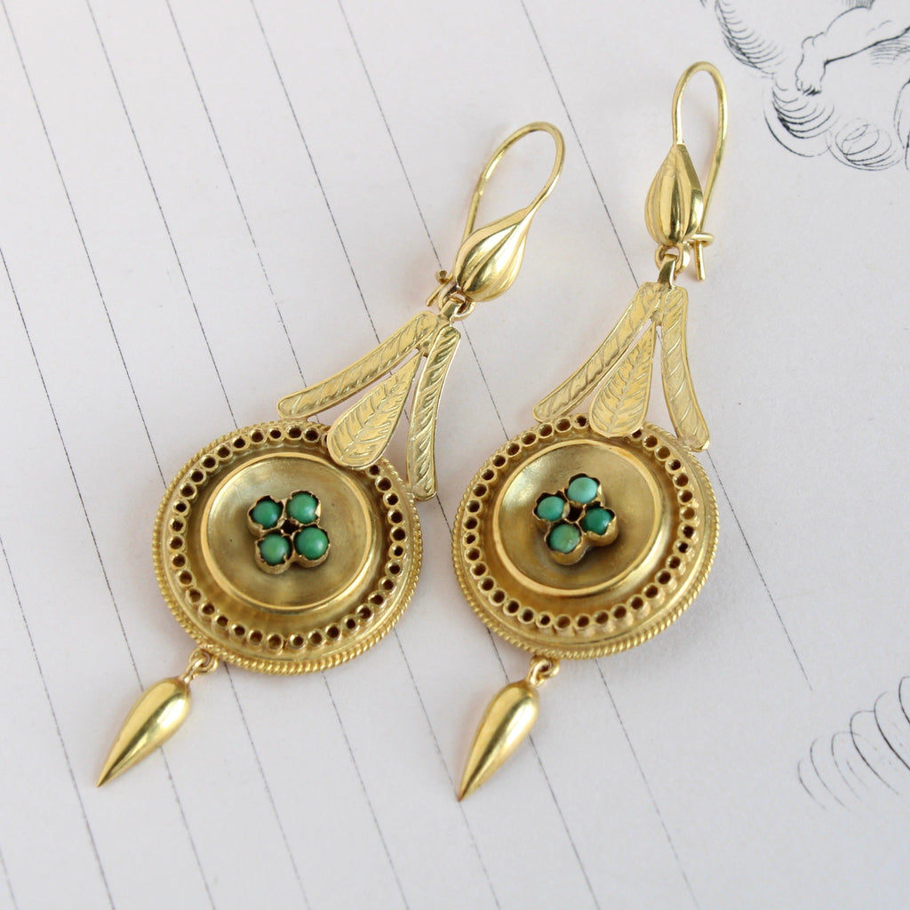Antique yellow gold drop earrings with a tiny turquoise cabochons and tear drop gold charms.