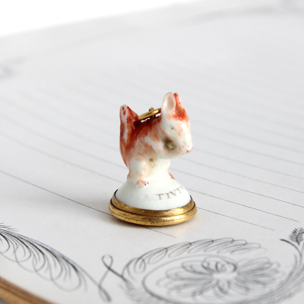antique porcelian squirrel pendant with an agate wax seal carved  with a tree and fence