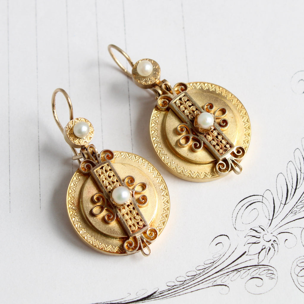 Antique round yellow gold earrings with ornate wire filigree designs set with white pearls