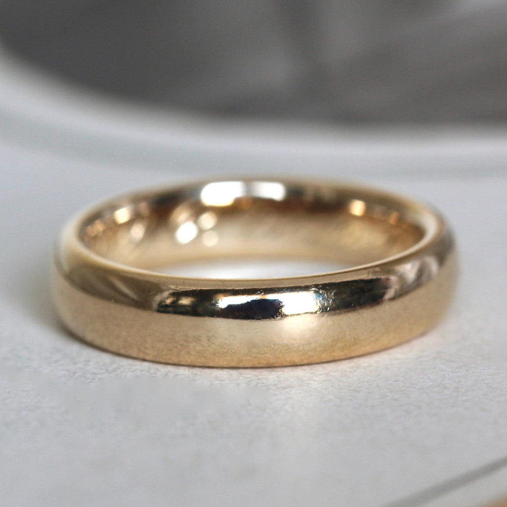 Antique 18k yellow gold wedding band with high polish finish, dated 1912.