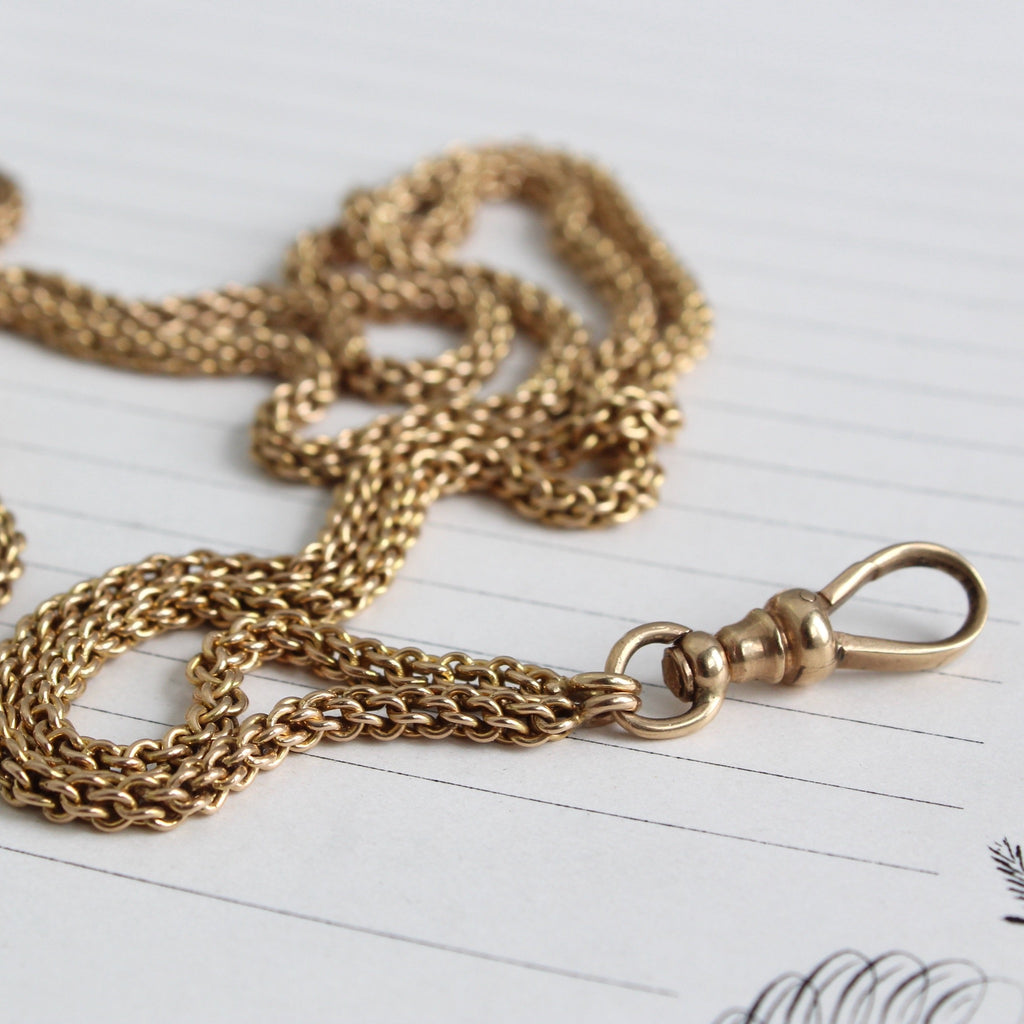 Antique yellow gold wheat link chain with charm holder clasp.
