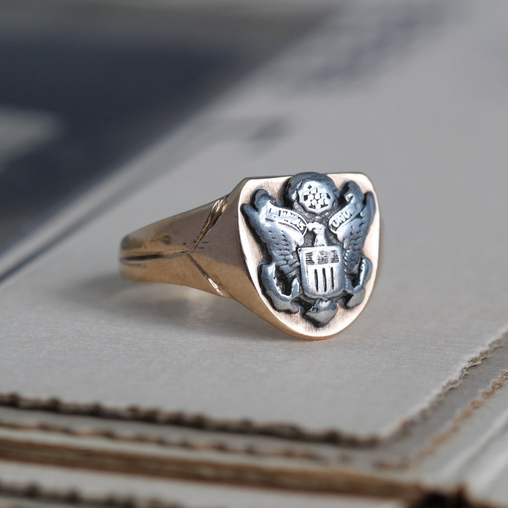 14k yellow gold ring with a sterling silver Army Corps insignia.