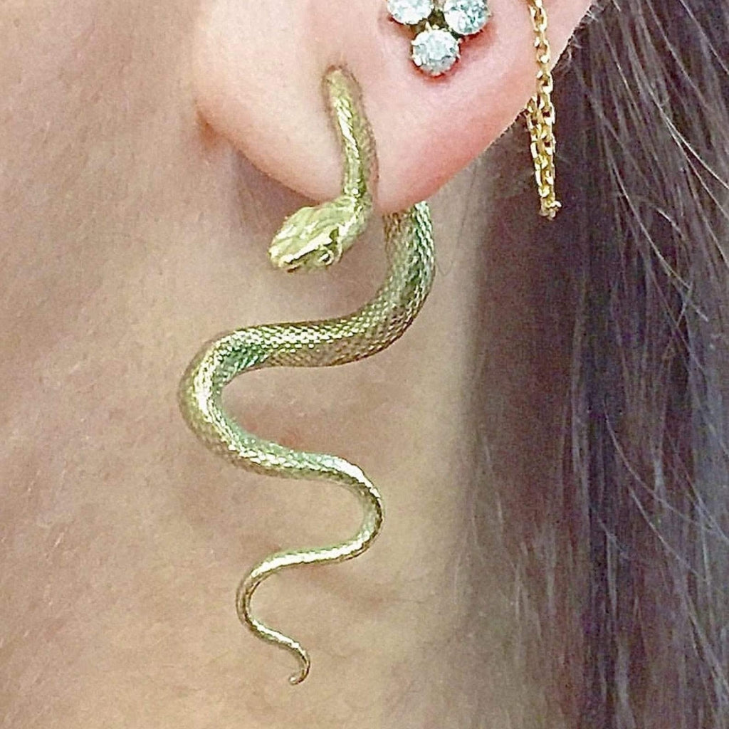 Handmade yellow gold serpentine snake earring with realistic scale detailing.