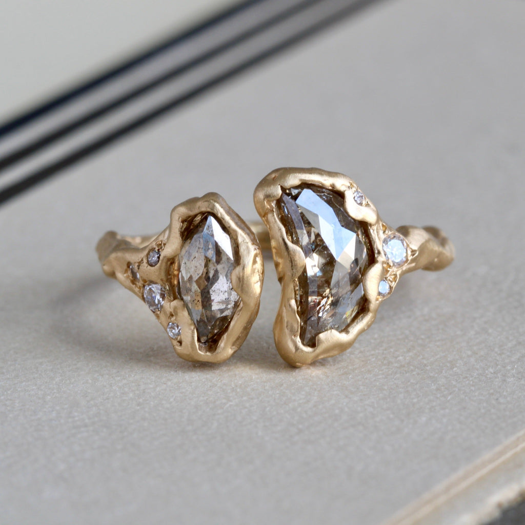 Handmade recycled yellow gold ring with two salt and pepper marquis and crescsent shaped diamonds side by side in melted gold bezels and scattered tiny diamonds throughout the metal